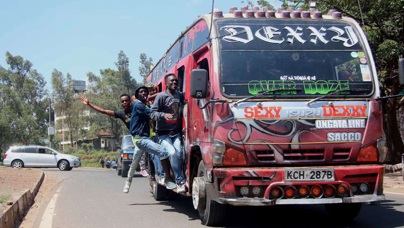 Youths pulling off awesome stunts on a moving matatu on the streets of Nairobi. PHOTO | KANYIRI WAHITO