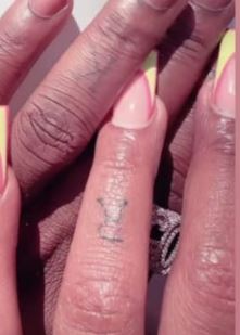 Kajala and Harmonize ring finger tattooes