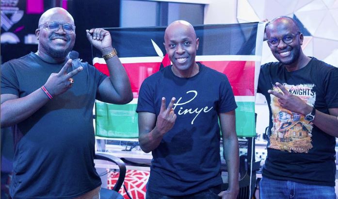 Kenyan radio host and rapper Point Blank Evumbi with DJ Pinye and a colleague