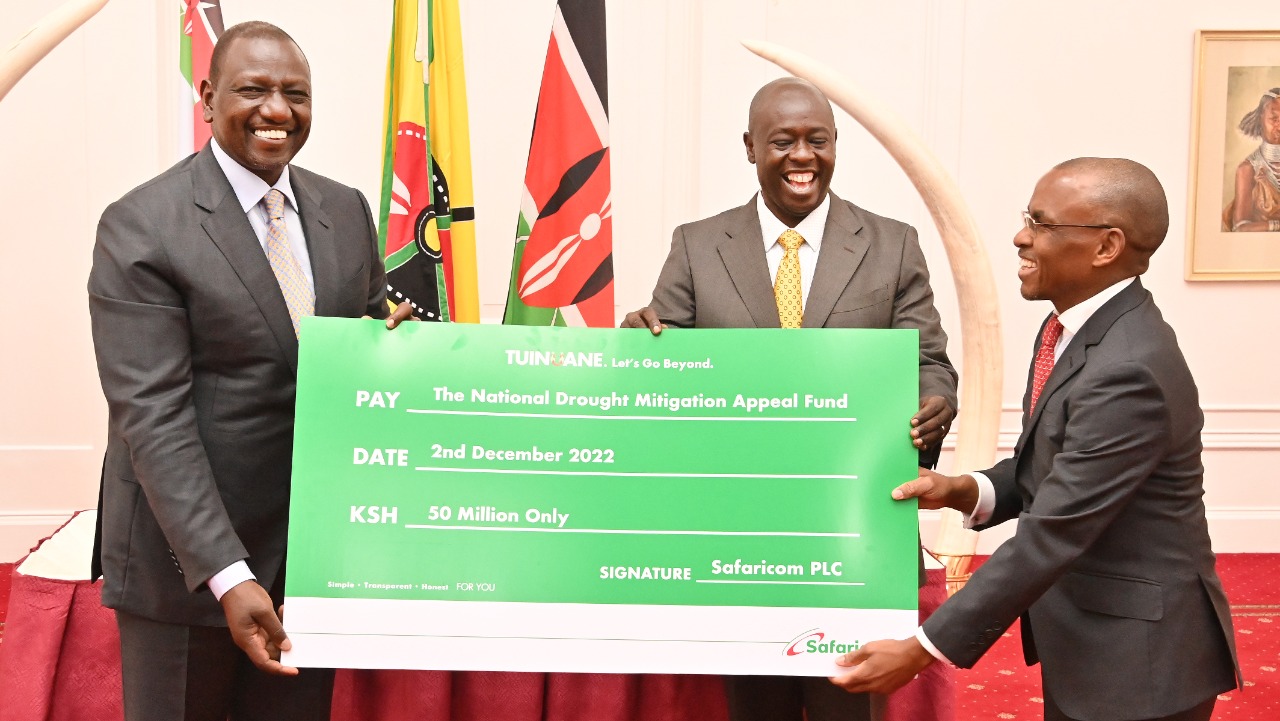 President Ruto and his deputy Rigathi Gachagua receive a cheque